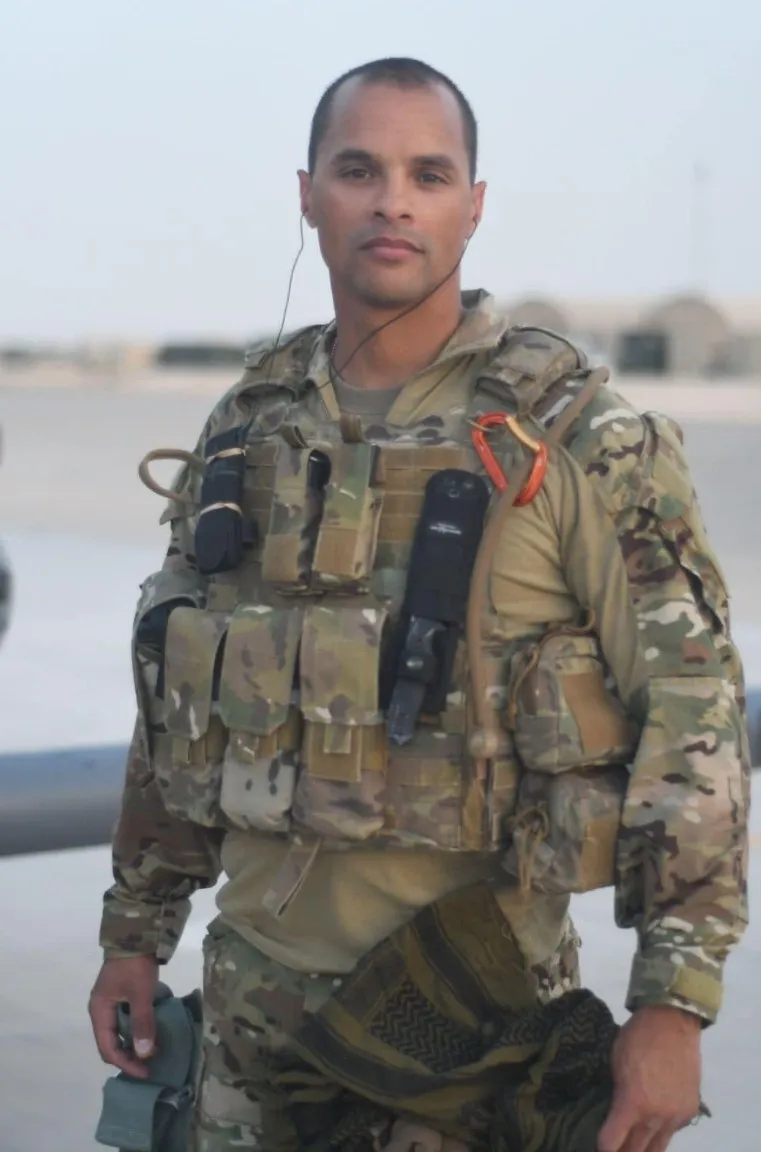 Deployed with the 129th Rescue Wing. Seth Steward in U.S. Air Force combat gear and body armor on a flight line during an overseas deployment.