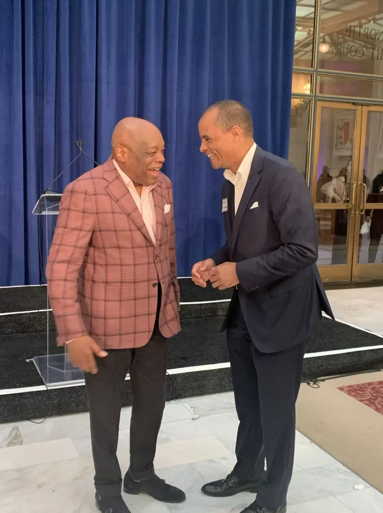 In the community. Seth Steward in conversation with a guest at a civic reception.